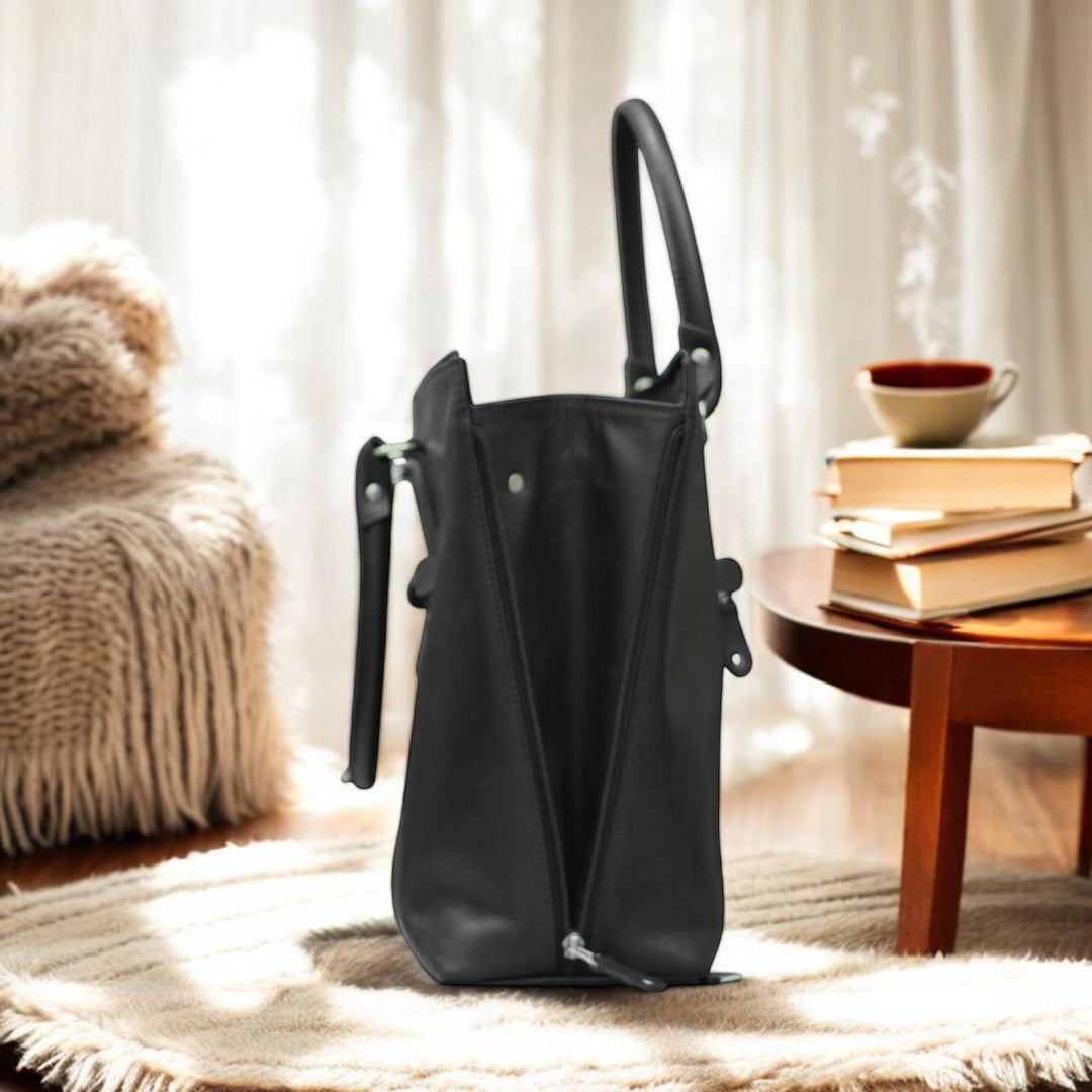 Side View – Side angle highlighting the tote’s spacious depth and soft leather texture.

