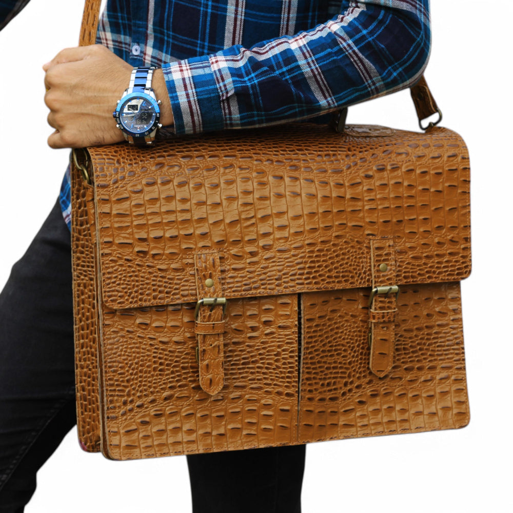 Expertly crafted with genuine alligator print leather, this handmade tan bag is perfect for the office or daily use. Its spacious design can accommodate a laptop, making it the ideal choice for tech-savvy professionals. A sophisticated and stylish choice for men, this bag is sure to elevate any outfit.