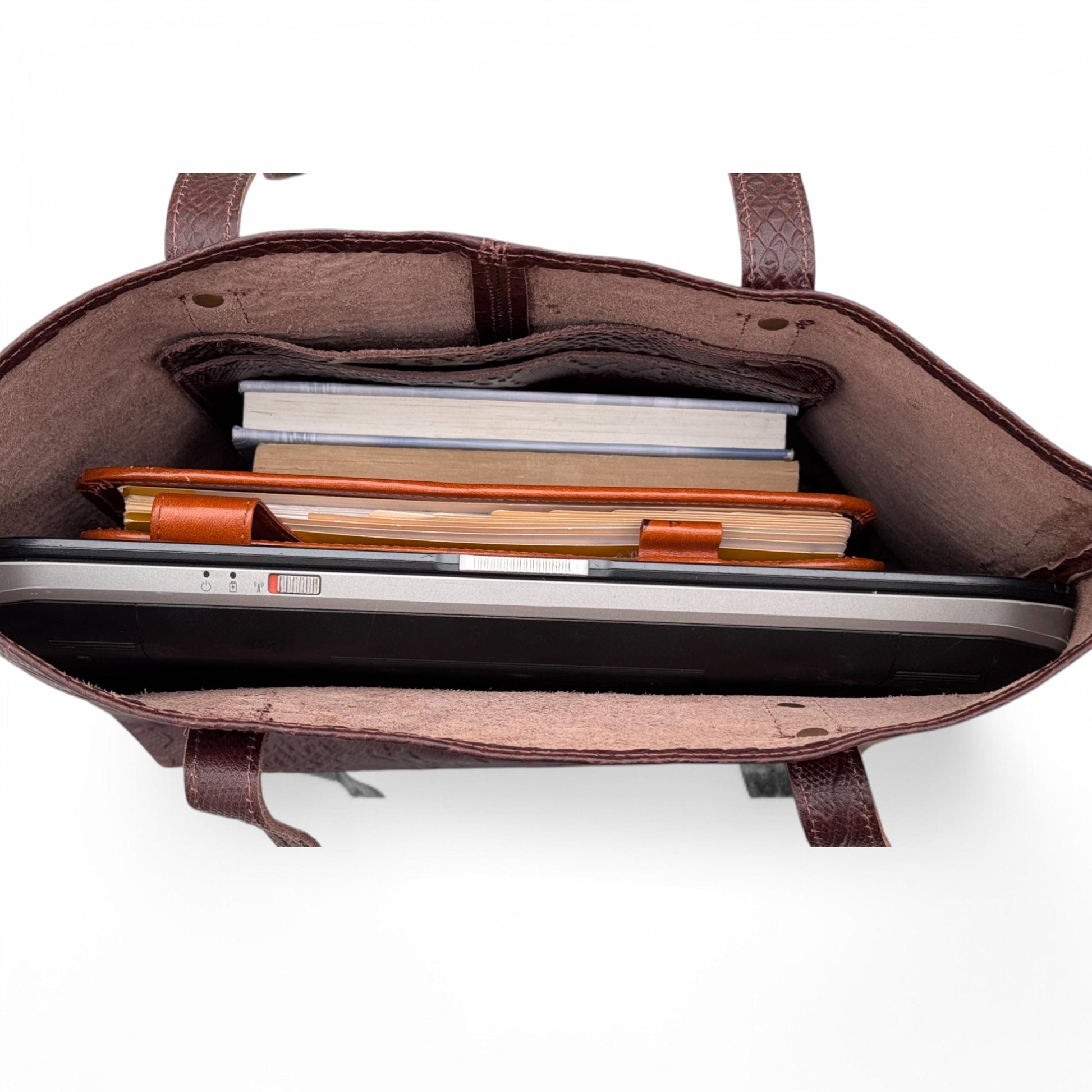 Interior View – Inside shot showing roomy compartment and small inner pocket for essentials.

