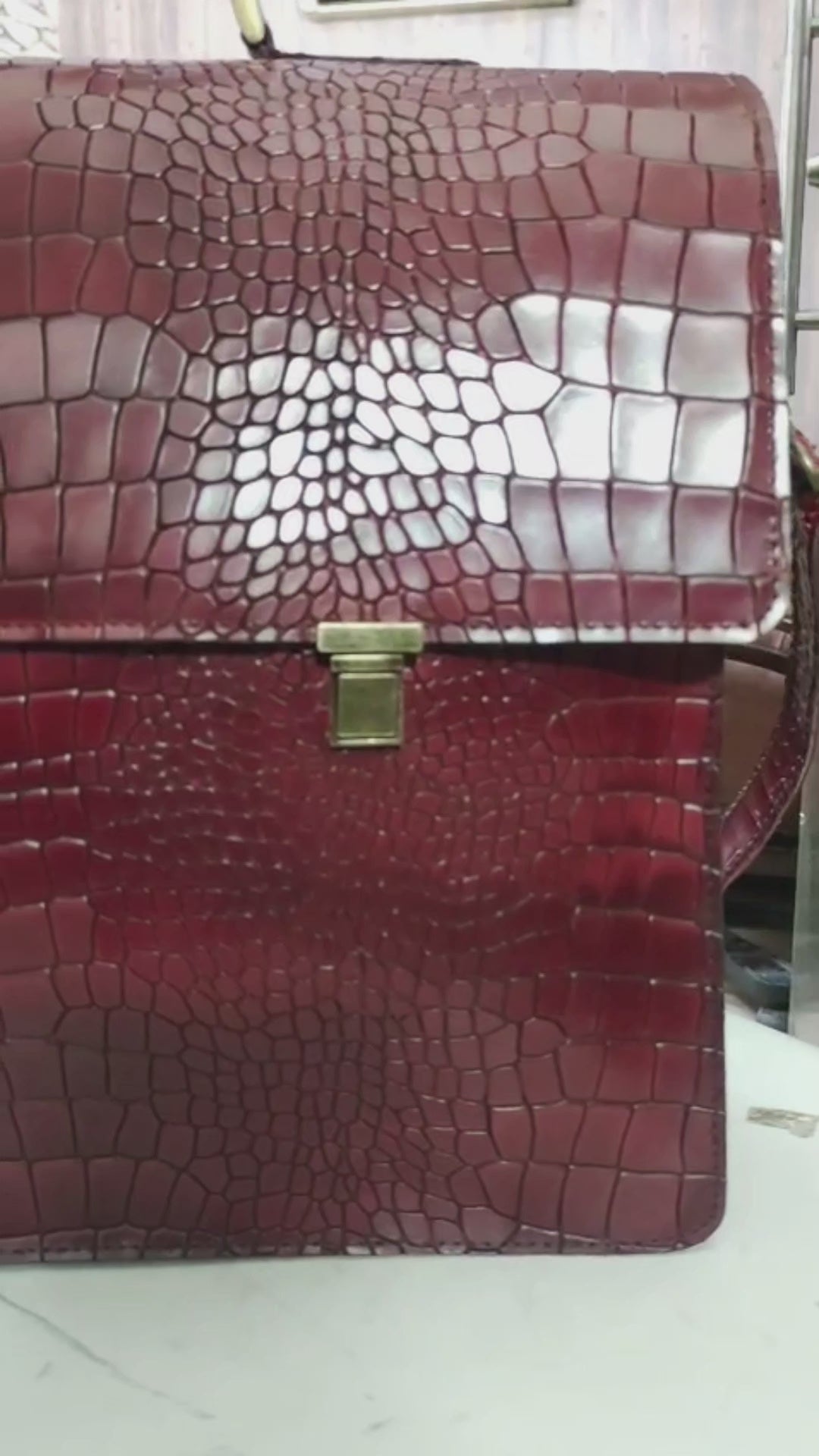 Front view of 16-inch handmade leather briefcase in alligator texture

